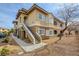 Inviting two-story condo building featuring a neutral color scheme, well-maintained landscaping, and convenient stair access at 833 Aspen Peak Loop # 712, Henderson, NV 89011