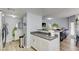 Open-concept kitchen with sleek appliances and a breakfast bar, seamlessly connected to the living and dining areas at 833 Aspen Peak Loop # 712, Henderson, NV 89011