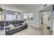 Spacious open-concept living area with wood-look floors that transitions smoothly into dining area and kitchen at 833 Aspen Peak Loop # 712, Henderson, NV 89011
