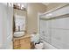 Cozy bathroom featuring a shower-tub combo with sliding glass doors and a modern vessel sink at 8925 Rio Verde Ave, Las Vegas, NV 89147