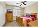 Bedroom with carpet, shutters, a ceiling fan, and traditional furnishings at 8925 Rio Verde Ave, Las Vegas, NV 89147