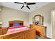 Bedroom showcasing a neutral palette, ceiling fan and traditional furnishings at 8925 Rio Verde Ave, Las Vegas, NV 89147