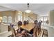Formal dining room featuring a large table, chair set, and polished floors at 8925 Rio Verde Ave, Las Vegas, NV 89147