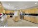 Spacious kitchen with granite countertops, stainless appliances, and ample cabinet space at 8925 Rio Verde Ave, Las Vegas, NV 89147