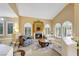 Bright living room boasting a fireplace, neutral tones, and plantation shutters at 8925 Rio Verde Ave, Las Vegas, NV 89147