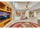 Bright living room with high ceilings, fireplace, and backyard access at 8925 Rio Verde Ave, Las Vegas, NV 89147