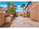 Paver patio featuring an outdoor kitchen and desert landscaping, perfect for entertaining at 8925 Rio Verde Ave, Las Vegas, NV 89147