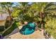 Aerial view of a private backyard with a gorgeous pool, spa, and serene landscaping at 9616 Grand Isle Ln, Las Vegas, NV 89144