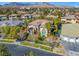 Aerial view of home in a neighborhood setting featuring a mountain backdrop at 9616 Grand Isle Ln, Las Vegas, NV 89144