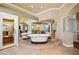 Luxurious bathroom with dual soaking tubs, mirrored walls, and elegant tile flooring at 9616 Grand Isle Ln, Las Vegas, NV 89144