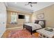 Comfortable bedroom with natural light, window seating, and hardwood floors at 9616 Grand Isle Ln, Las Vegas, NV 89144