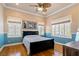 Comfortable bedroom with lots of natural light and a ceiling fan at 9616 Grand Isle Ln, Las Vegas, NV 89144