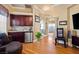 Charming bonus room with a wet bar, wood floors, and elegant archways at 9616 Grand Isle Ln, Las Vegas, NV 89144