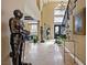 Grand foyer featuring high ceilings, elegant staircase, and decorative knight statues at 9616 Grand Isle Ln, Las Vegas, NV 89144