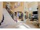 Expansive foyer showcasing a staircase, art, and sophisticated design elements at 9616 Grand Isle Ln, Las Vegas, NV 89144