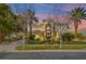 Stunning two-story home with lush landscaping, mature trees and well-manicured lawn at 9616 Grand Isle Ln, Las Vegas, NV 89144