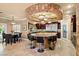Open kitchen featuring a large island, breakfast table and stainless steel appliances at 9616 Grand Isle Ln, Las Vegas, NV 89144
