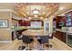 Chef's kitchen boasts a large island, stainless steel appliances, and custom cabinetry at 9616 Grand Isle Ln, Las Vegas, NV 89144
