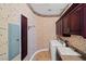 Well-equipped laundry room with overhead cabinets and modern appliances at 9616 Grand Isle Ln, Las Vegas, NV 89144