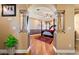 The main bedroom suite is showcased from the entryway with hardwood floors and elegant furniture at 9616 Grand Isle Ln, Las Vegas, NV 89144