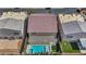 Aerial view of a home with a tile roof and backyard pool, showcasing its prime location at 9781 Arcadian Estate Ct, Las Vegas, NV 89141