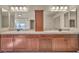 Bathroom with double vanity, neutral color palette, and modern fixtures at 9781 Arcadian Estate Ct, Las Vegas, NV 89141