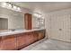 Well-appointed bathroom with double sinks, ample counter space, and stylish lighting at 9781 Arcadian Estate Ct, Las Vegas, NV 89141