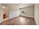 Large bedroom with wood floors and ensuite bathroom at 9781 Arcadian Estate Ct, Las Vegas, NV 89141