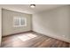 Bright bedroom with hardwood floors, a window, and fresh neutral paint at 9781 Arcadian Estate Ct, Las Vegas, NV 89141