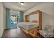 Bedroom features a Murphy bed with a walkout to the pool at 9781 Arcadian Estate Ct, Las Vegas, NV 89141