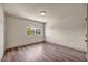 Bedroom with wood flooring and natural light at 9781 Arcadian Estate Ct, Las Vegas, NV 89141