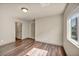 Spacious bedroom with hardwood floors, recessed lighting, and large window at 9781 Arcadian Estate Ct, Las Vegas, NV 89141