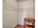 Ample closet with wire shelving and a vintage side table at 9781 Arcadian Estate Ct, Las Vegas, NV 89141