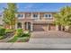 Charming two-story home boasting a three-car garage and meticulously landscaped front yard at 9781 Arcadian Estate Ct, Las Vegas, NV 89141
