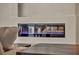 Close-up of a modern fireplace with decorative blue glass, adding a touch of elegance to the living space at 9781 Arcadian Estate Ct, Las Vegas, NV 89141
