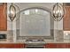 Gourmet kitchen features a stainless steel cooktop and granite countertops at 9781 Arcadian Estate Ct, Las Vegas, NV 89141