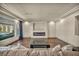 Bright living room features hardwood floors and a modern fireplace at 9781 Arcadian Estate Ct, Las Vegas, NV 89141