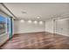 Open living room with hardwood floors, recessed lighting, and a bright window at 9781 Arcadian Estate Ct, Las Vegas, NV 89141