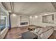 Bright living room features hardwood floors and a modern fireplace at 9781 Arcadian Estate Ct, Las Vegas, NV 89141