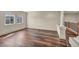 Second level open living area with luxury vinyl plank flooring and decorative columns at 9781 Arcadian Estate Ct, Las Vegas, NV 89141