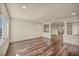 Spacious and bright living area with dark wood floors and neutral walls at 9781 Arcadian Estate Ct, Las Vegas, NV 89141