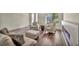 Comfortable living room with fireplace, hardwood floors, and stylish seating at 9781 Arcadian Estate Ct, Las Vegas, NV 89141