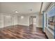 Large living room showcasing beautiful hardwood floors and neutral tones at 9781 Arcadian Estate Ct, Las Vegas, NV 89141