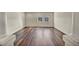 Upstairs living area with gorgeous wood flooring and view of neighborhood at 9781 Arcadian Estate Ct, Las Vegas, NV 89141