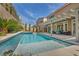 Sparkling swimming pool with blue tile and a well-manicured backyard with lawn at 9781 Arcadian Estate Ct, Las Vegas, NV 89141