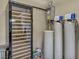 Well-equipped utility room with a wine cooler and water filtration system at 9781 Arcadian Estate Ct, Las Vegas, NV 89141