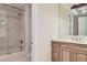 Bathroom featuring glass enclosed shower with a tub and neutral color scheme at 9909 Moon Valley Pl, Las Vegas, NV 89134