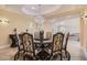 Refined dining room featuring a decorative chandelier and round table at 9909 Moon Valley Pl, Las Vegas, NV 89134