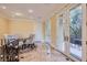 Bright dining area with table, chairs, and access to patio through glass doors at 9909 Moon Valley Pl, Las Vegas, NV 89134