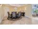 Formal dining room featuring chandelier, round table, and elegant decor at 9909 Moon Valley Pl, Las Vegas, NV 89134